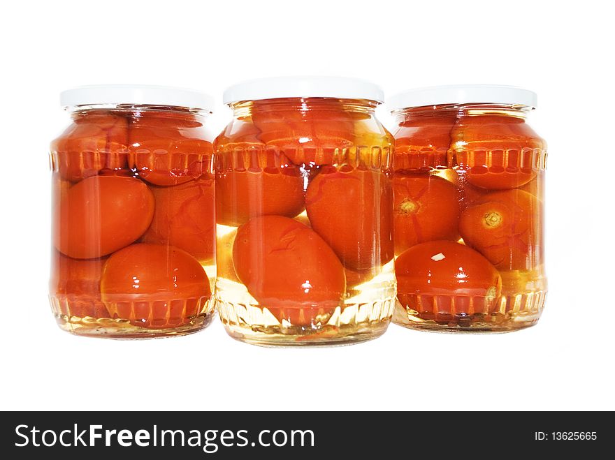 Tomatoes in bank on a white background