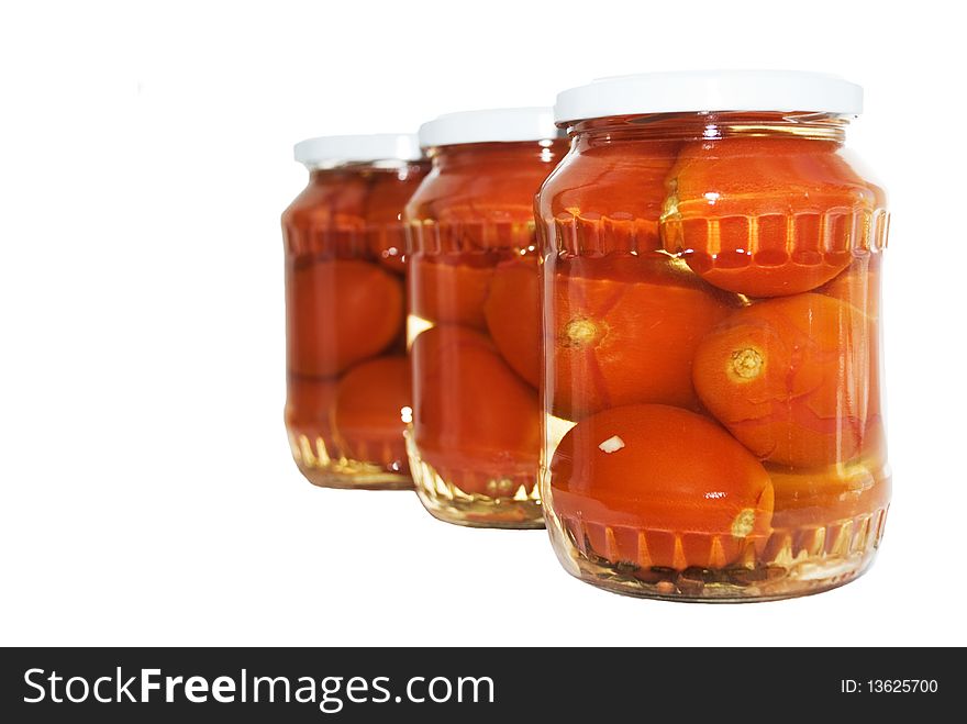 Tomatoes in bank on a white background