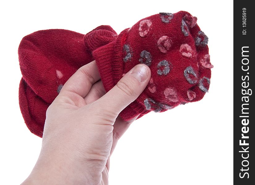 Pair of Red Socks being folded up after the laundry.  Isolated on White with a Clipping Path.