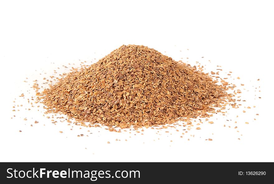 Finely milled shell of pine nuts isolated on a white background