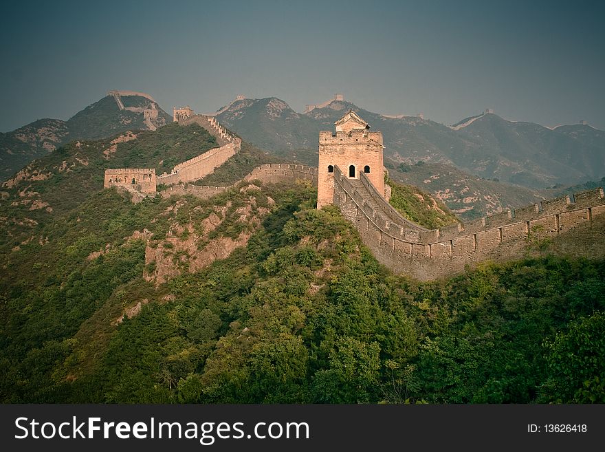 Part of Great Wall surrounded by green trees, China