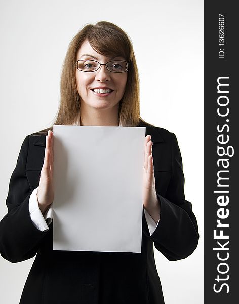 A vertical image of a pretty female salesperson holding up a blank notice ready for copy. A vertical image of a pretty female salesperson holding up a blank notice ready for copy