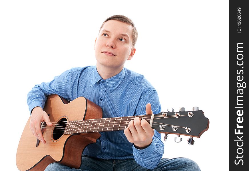 Young Male Guitarist with his acoustic guitar