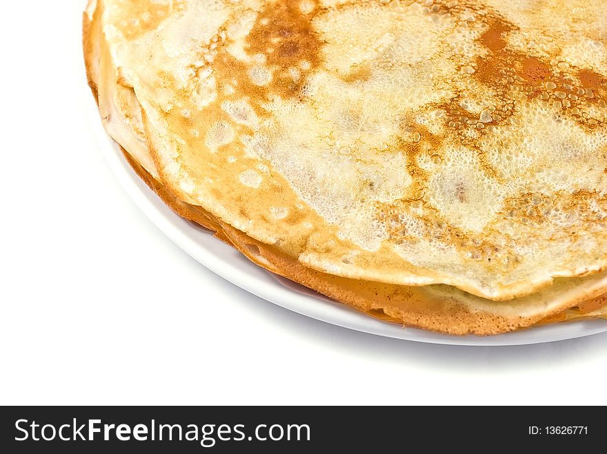 Fresh traditional pancakes on a white plate. Fresh traditional pancakes on a white plate