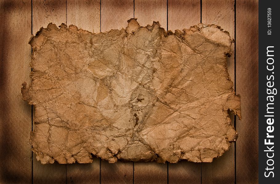 Old Paper On A Wooden Background