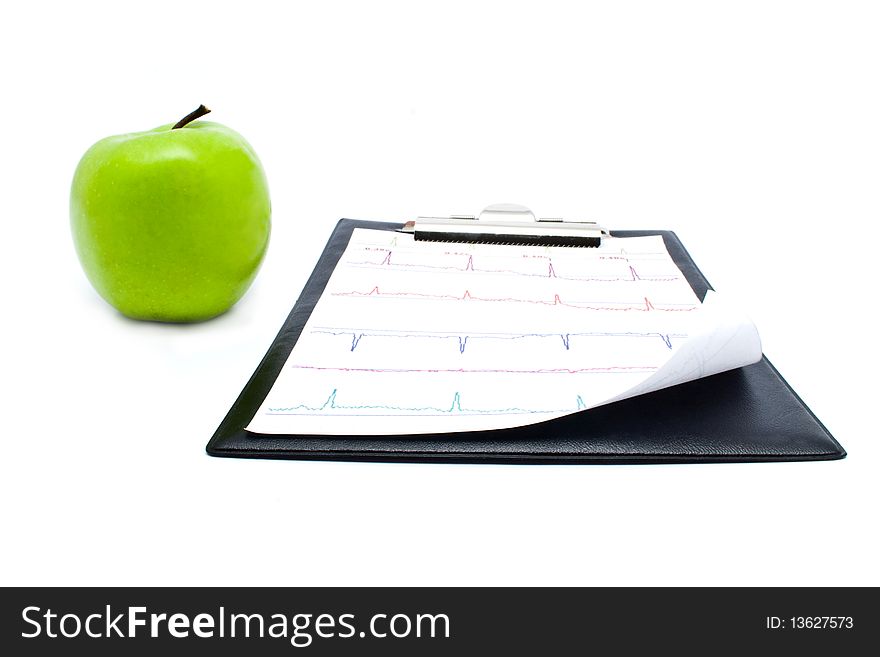 Plane-table with a cardiogram and apple for your illustrations