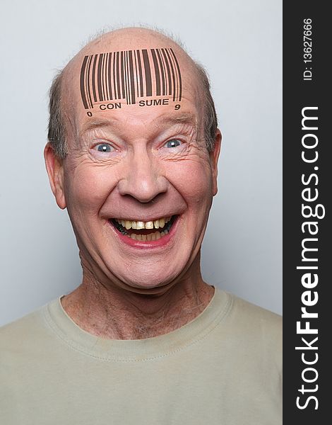 Idiotic consumer with a bar code on his forehead. Idiotic consumer with a bar code on his forehead