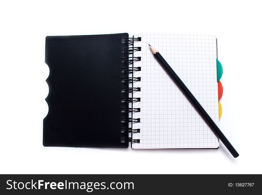 Notebook with a spring and pencil on a white background