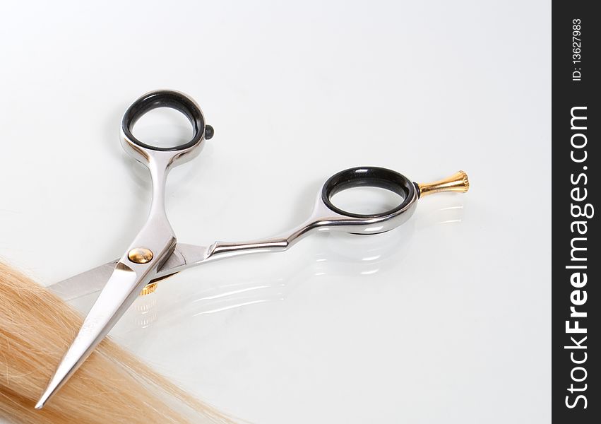 Lock of hair and scissors