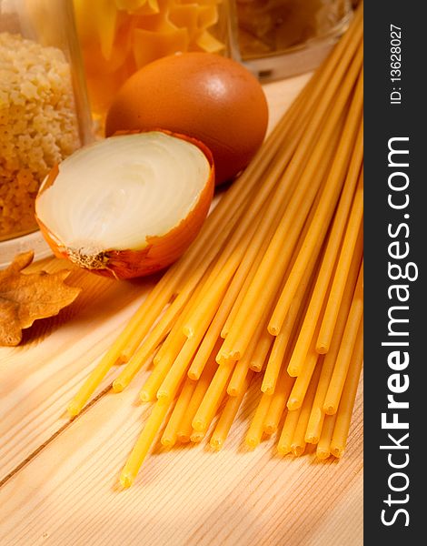 Spaghetti onion and egg on the kitchen table. selective focus