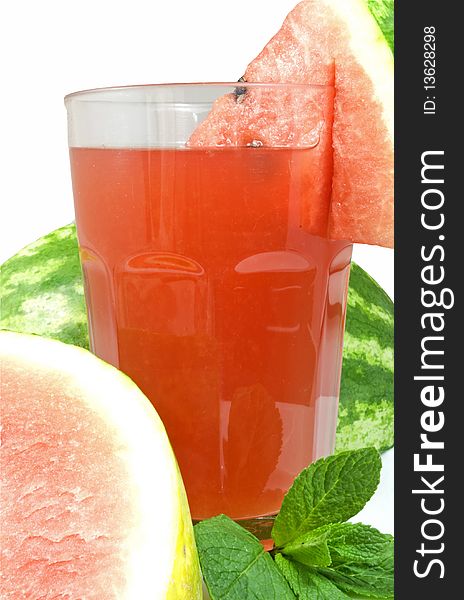 Fresh water melon juice decorated with melon slices and mint leaves