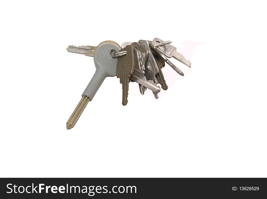 A bunch of old keys on an isolated background. A bunch of old keys on an isolated background