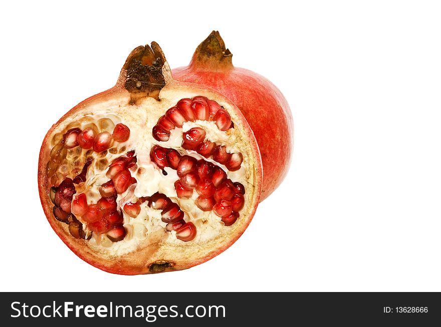 Juicy, bright pomegranates isolated on a white background. Juicy, bright pomegranates isolated on a white background.