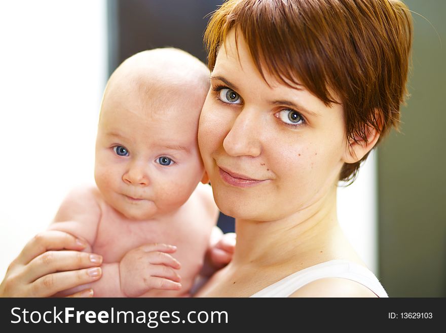 Closeup portrait happy young mother with baby boy