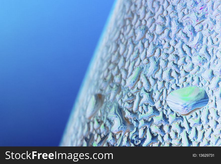 Abstract texture formed by water droplets on a blue background