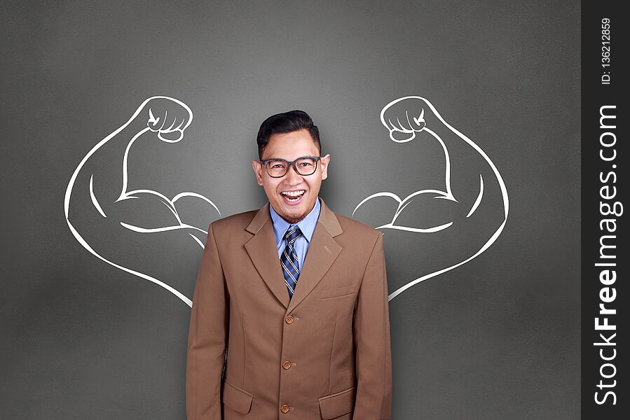 Business power concept. Young Asian businessman smiling with strong powerful arms drawn behind. Inner power authority. Business power concept. Young Asian businessman smiling with strong powerful arms drawn behind. Inner power authority