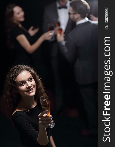 Stylish young woman with glass of champagne