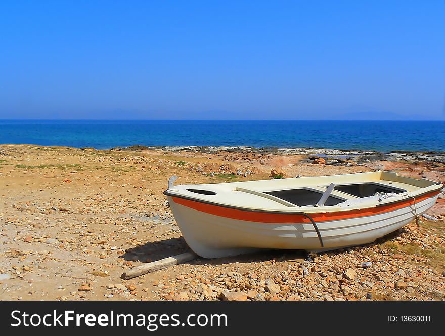Old boat on the beach,view of the beach,Mediterranean Sea in Greece