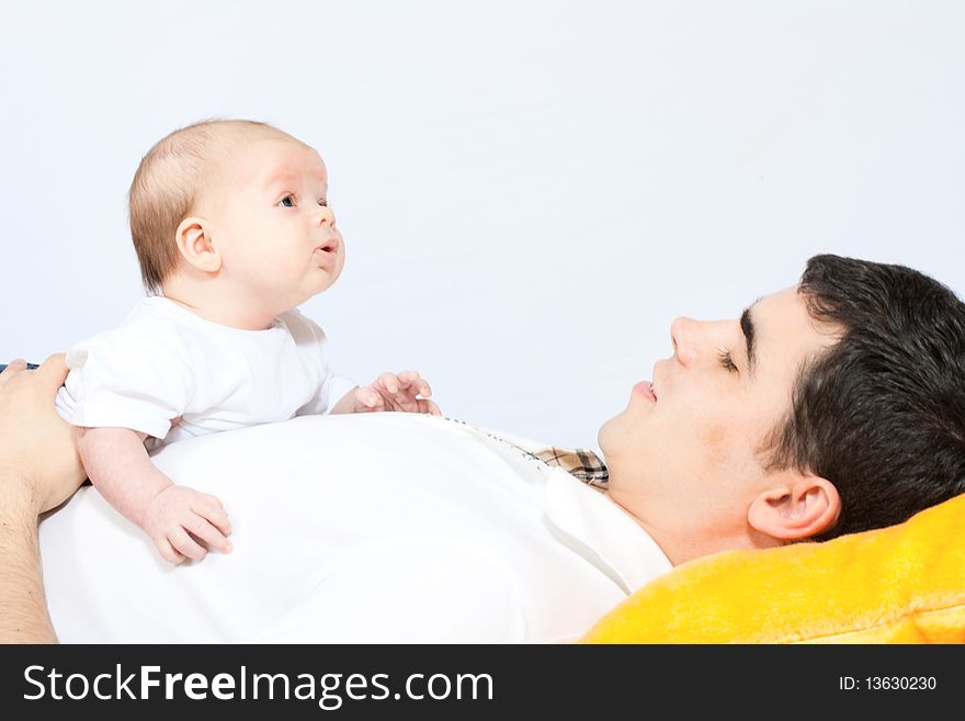 Happy family home: father playing with his little baby. Happy family home: father playing with his little baby