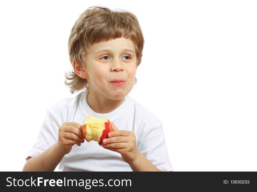 Little beautiful child playing and eating an apple - isolated on white. Little beautiful child playing and eating an apple - isolated on white