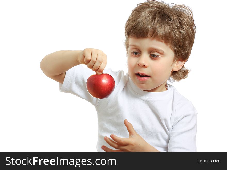 Little beautiful child playing and eating an apple - isolated on white. Little beautiful child playing and eating an apple - isolated on white