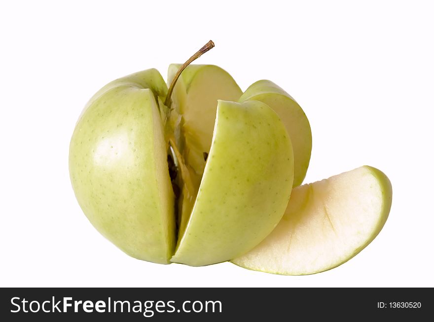 Freshly sliced organic apple, isolated on white background