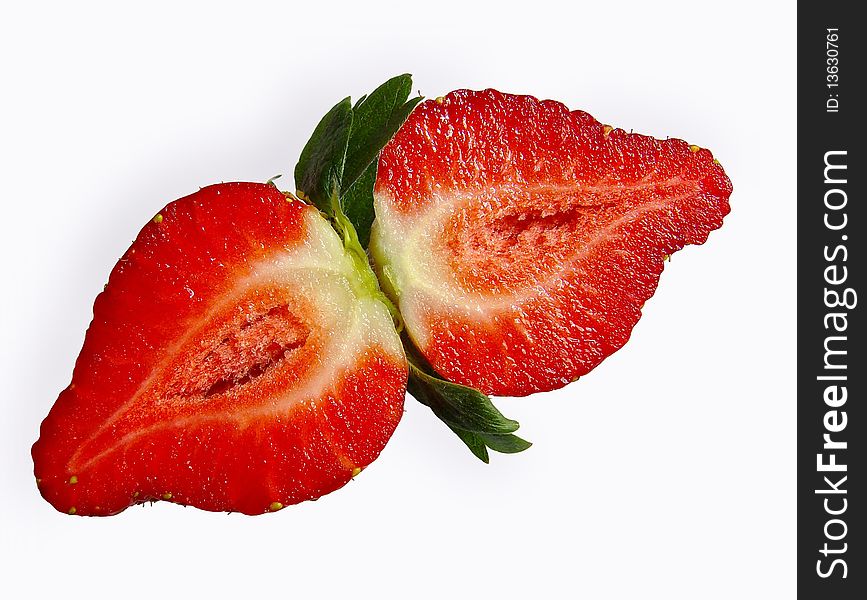 Strawberries cut in half on a white background. Strawberries cut in half on a white background