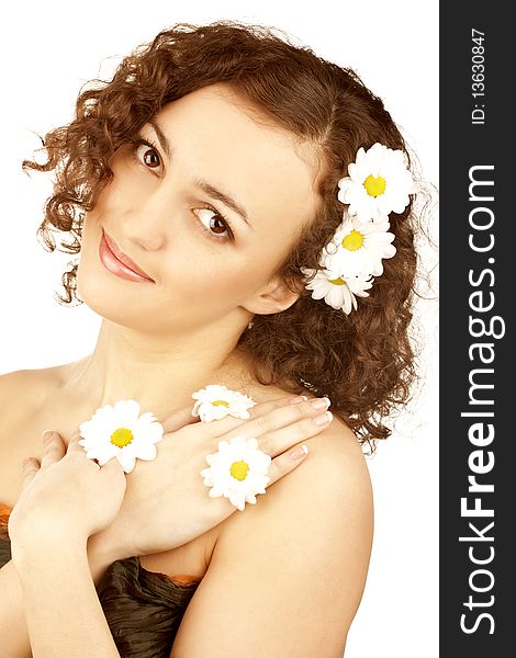 Beautiful woman with camomile flower on white background