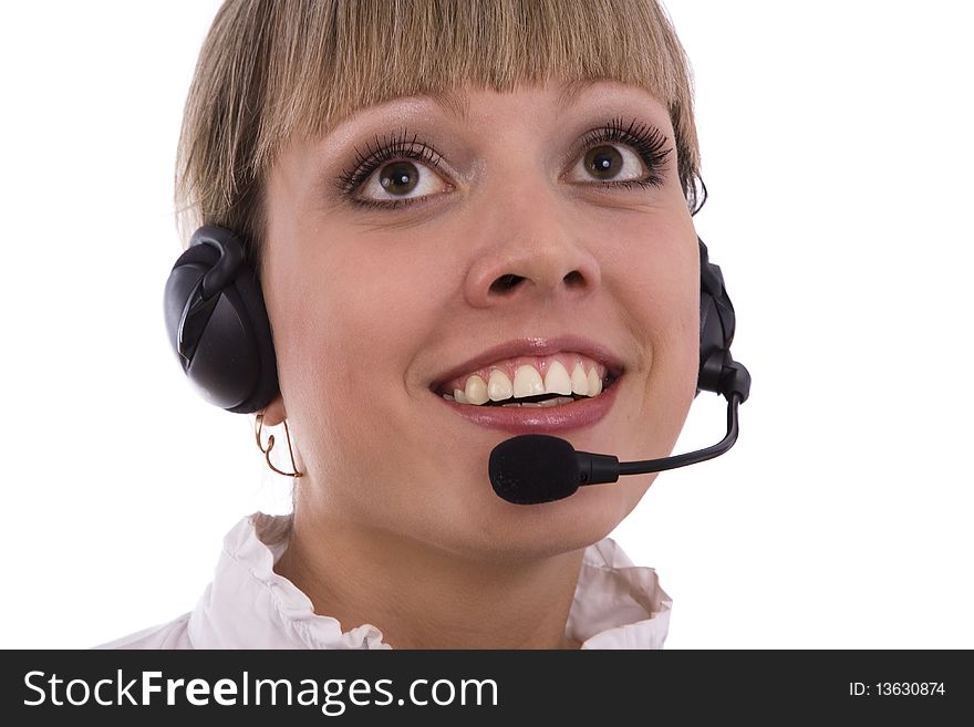 Telephone operator is looking up. Successful  businesswoman is speaking over the headset with a microphone. Woman with headset