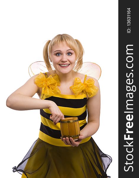 Bee costumes woman is eating honey. Woman wearing fancy dress on Halloween looking surprised. Cute girl in bee costume on white.