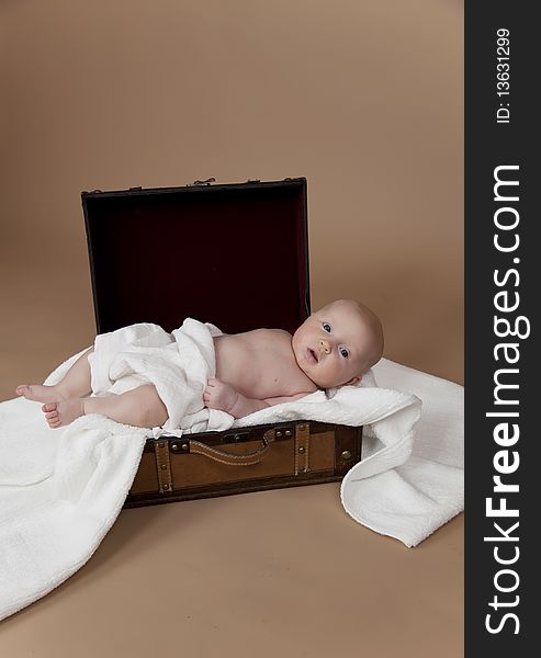 Close up of baby in the suitcase