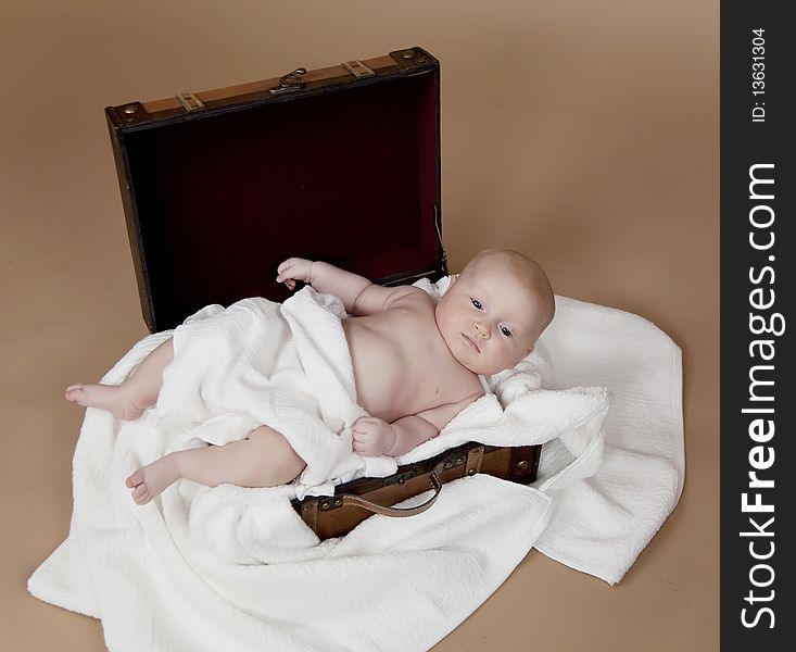Close up of baby in the suitcase