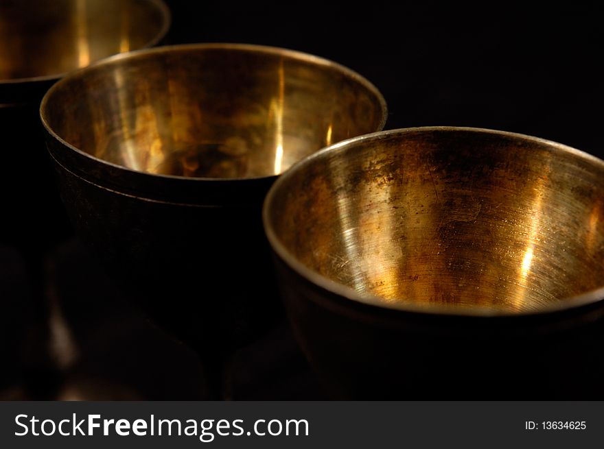 Antique decorative vintage silverware abstract close-up on black background. Antique decorative vintage silverware abstract close-up on black background