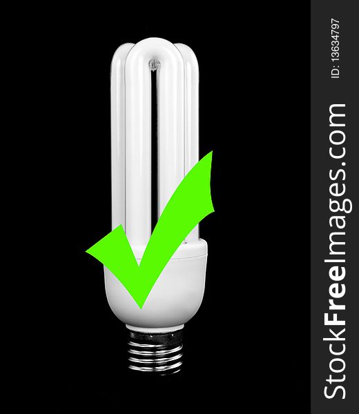 An energy saving light bulb isolated against a black background