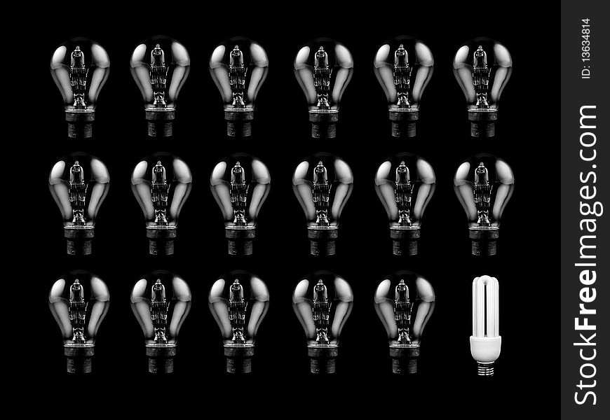 An energy saving light bulb isolated against a black background