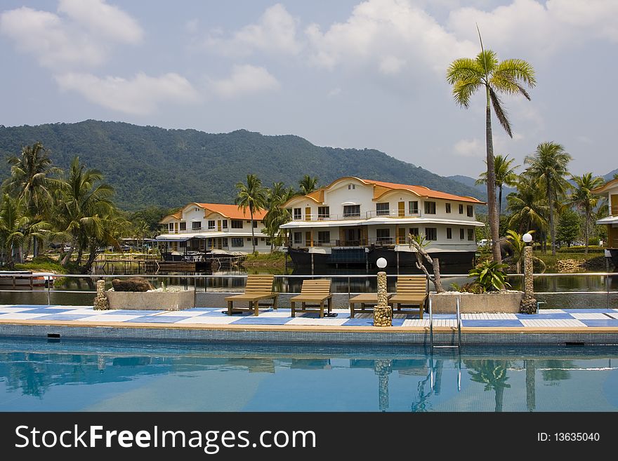 Tropical hotel on the background of mountains in Thailand