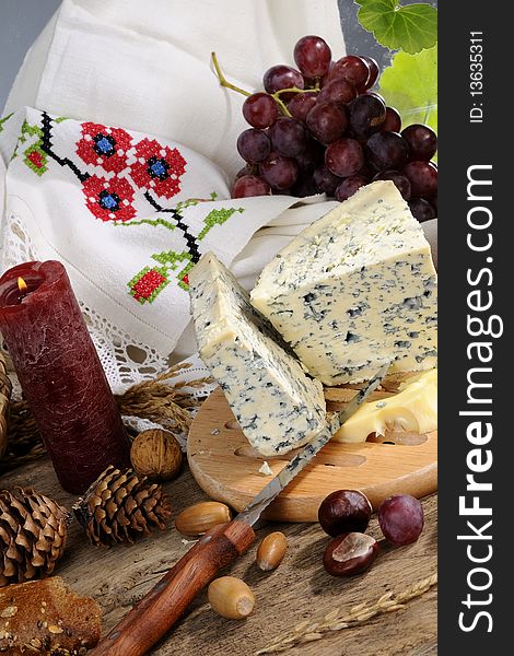 Closeup with blue cheese, fruits studio isolated, vintage mirror and traditional towel  in background. Closeup with blue cheese, fruits studio isolated, vintage mirror and traditional towel  in background