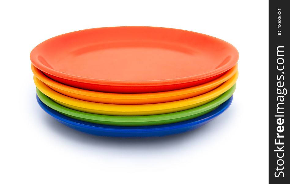 Colorful plates on white background