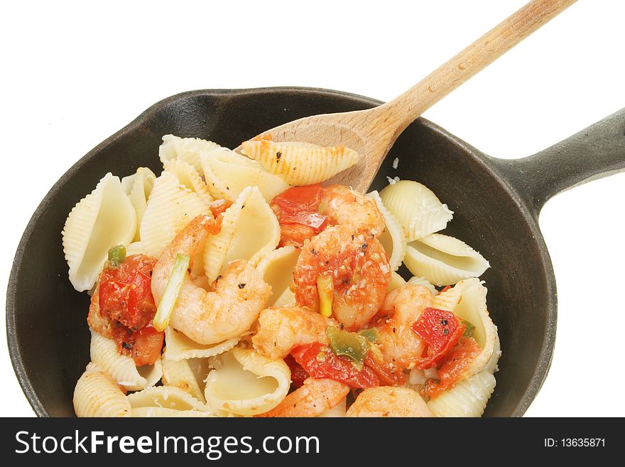 Closeup of prawns and pasta in a pan