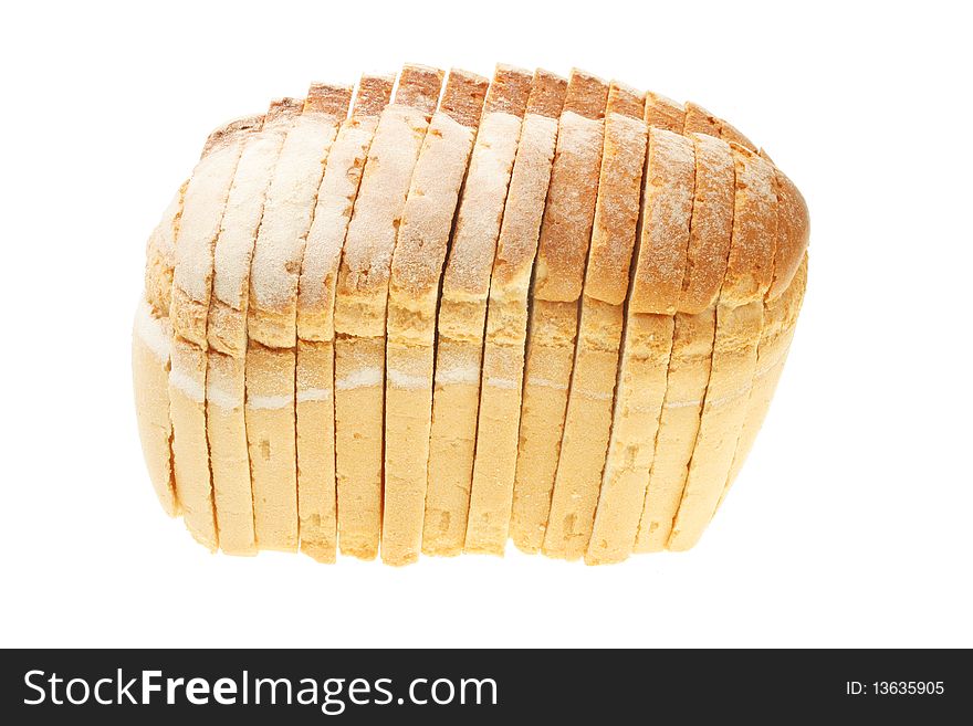 Sliced crusty farmhouse loaf of bread isolated on white. Sliced crusty farmhouse loaf of bread isolated on white