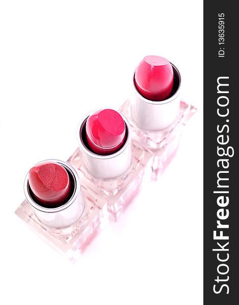 Red color lipsticks isolated on white background.