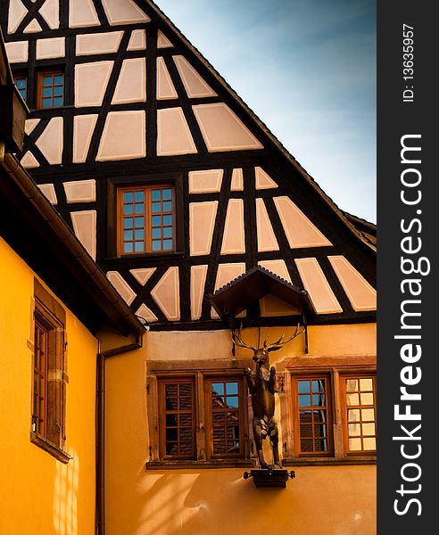 Traditional timber frame and stucco house in Riquewihr, , Alsace, France. Traditional timber frame and stucco house in Riquewihr, , Alsace, France