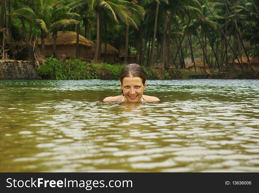Young attractive woman having fun in tropical river. Young attractive woman having fun in tropical river