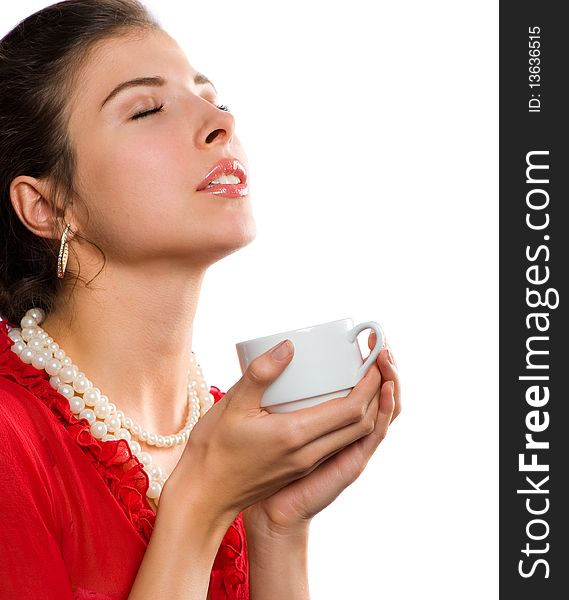 Portrait beautiful young brunette in red with a cup in his hands. Portrait beautiful young brunette in red with a cup in his hands