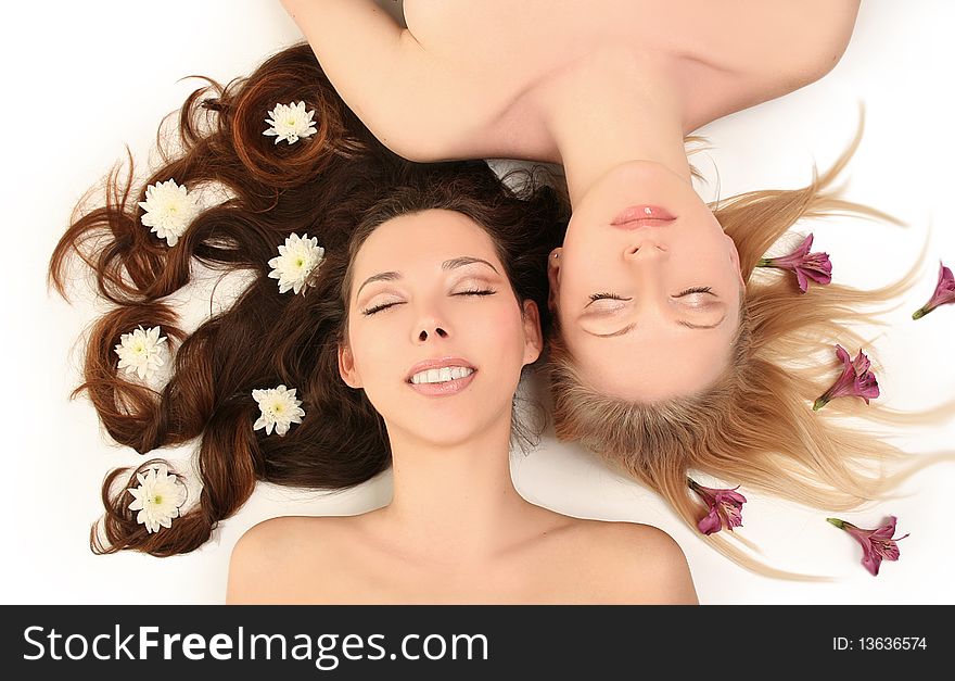 Blondy and brunette on white background