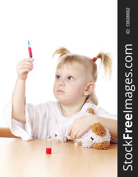 Child playing as a doctor with syringe