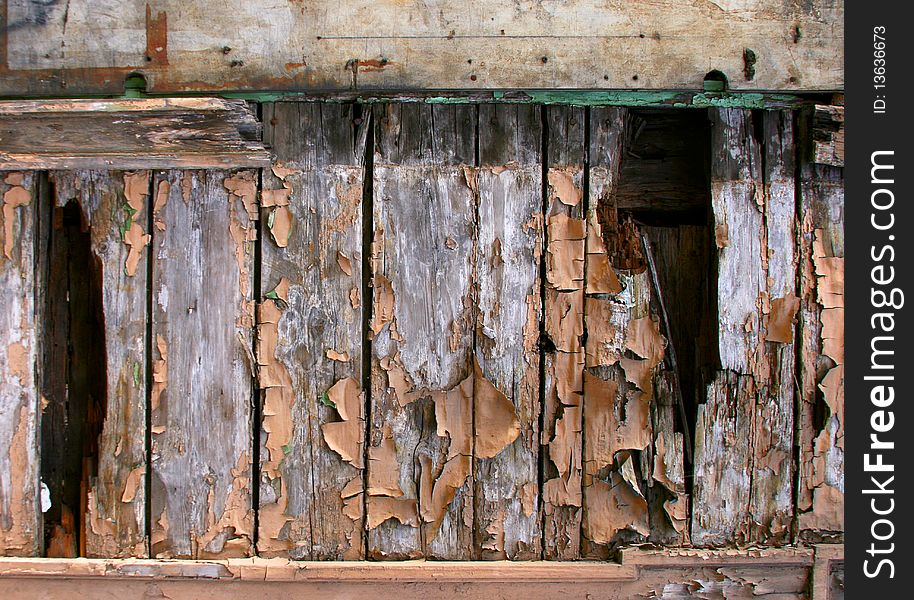 Grunge scratched texture / background on a cracked wooden wall. Grunge scratched texture / background on a cracked wooden wall.