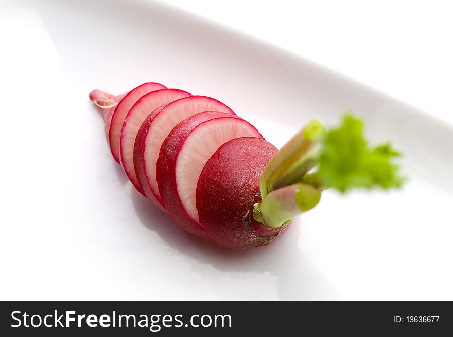 Sliced red radish on white background