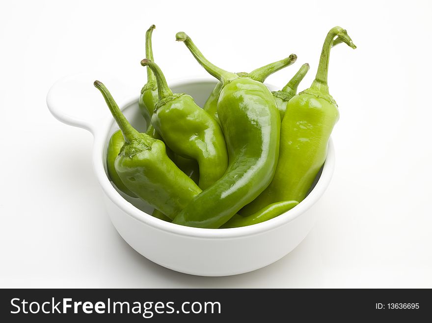 Green peppers in a white bowl. Green peppers in a white bowl