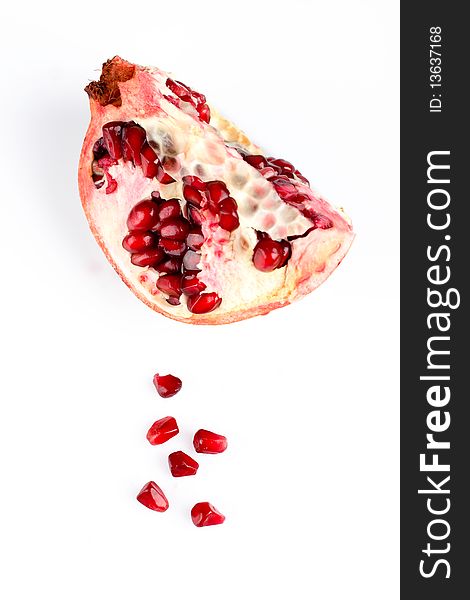 Piece of pomegranate isolated on the white